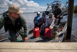 Lee County authorities evacuate people on an airboat in the aftermath of Hurricane Ian in Lee County, Florida, on October 1, 2022.