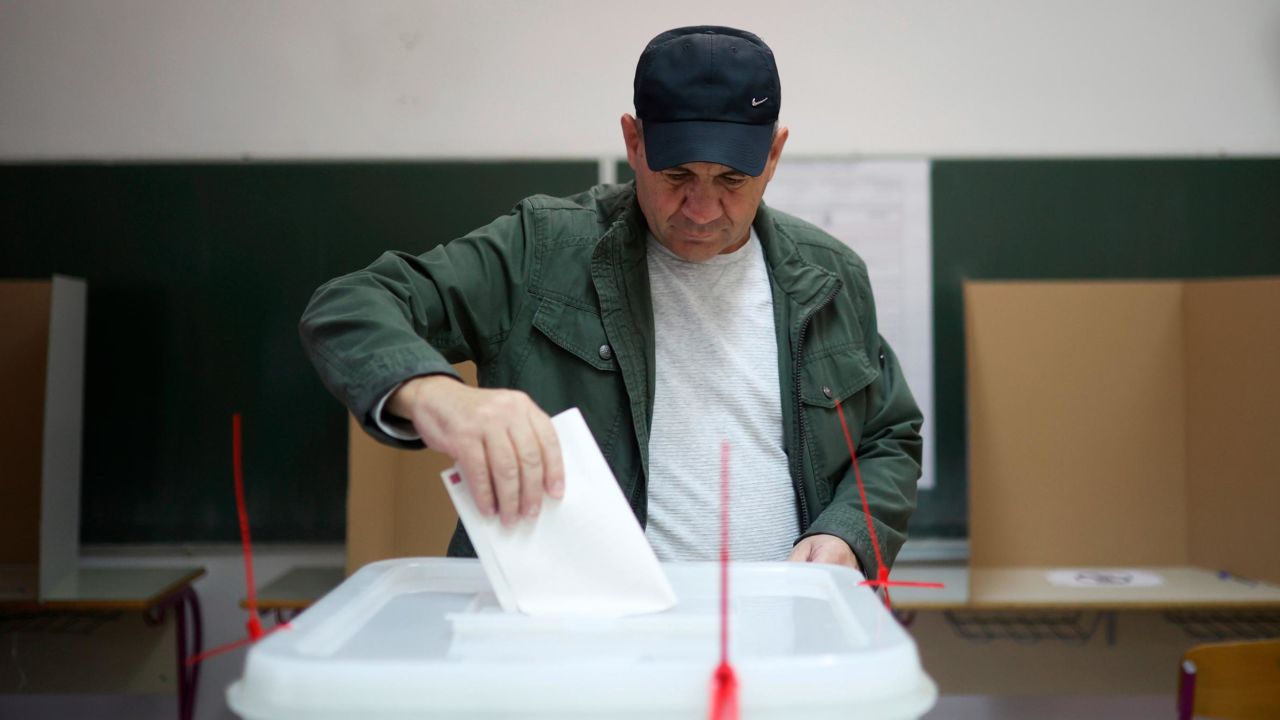 A man casts his vote at a poling station in Sarajevo, Bosnia on Sunday.