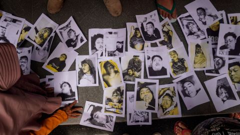 People looking for loved ones looked at photos provided by volunteers in Malang on Sunday.