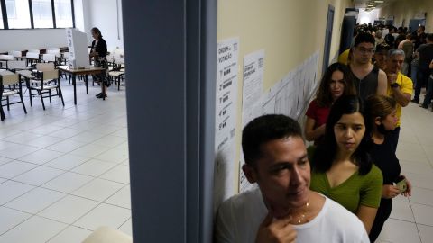 Voters line up during general elections in Brasilia on Sunday, October 2, 2022. 