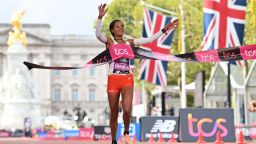 Ethiopia's Yalemzerf Yehualaw breaks the tape to win the women's race at the finish of the 2022 London Marathon in central London on October 2, 2022.