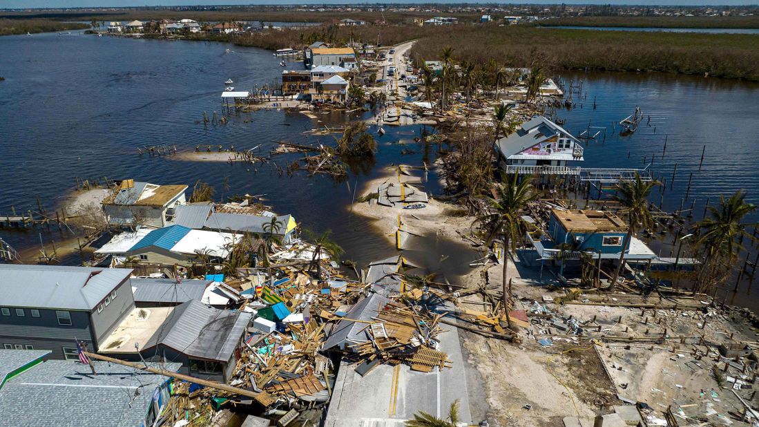 A broken section of road and destroyed houses are seen in Matlacha, Florida, on Saturday, October 1. 