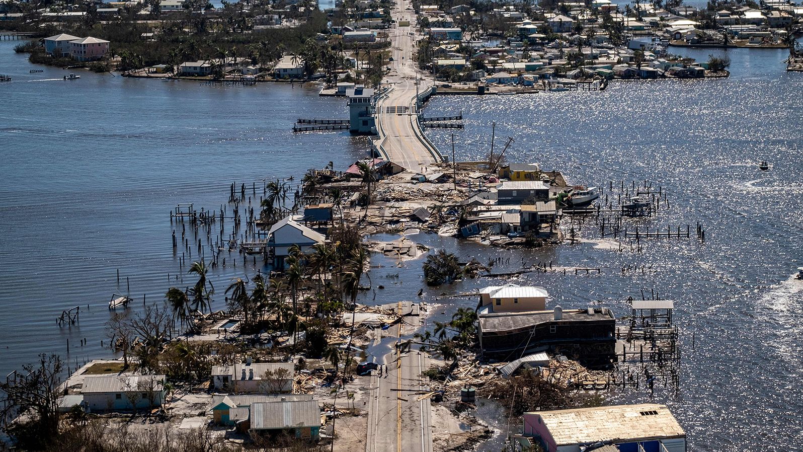 An aerial picture taken on September 30, 2022 shows the only access to the Matlacha neighborhood destroyed in the aftermath of Hurricane Ian in Fort Myers, Florida. 
