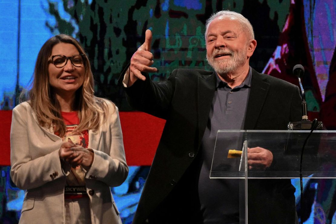 Former Brazilian President Luiz Inácio "Lula" da Silva gestures to supporters, with his wife, Rosangela da Silva, in Sao Paulo, Brazil, on October 2, 2022. 