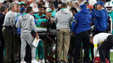 Medical staff tends to Tagovailoa as he is carted off on a stretcher after an injury during the second quarter of the game against the Bengals.