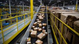 Packages move along a conveyor at an Amazon fulfillment center on Cyber Monday in Robbinsville, New Jersey, U.S., on Monday, Nov. 29, 2021. 