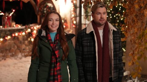 (From left) Lindsay Lohan and Chord Overstreet are pictured in a scene from "Falling For Christmas."