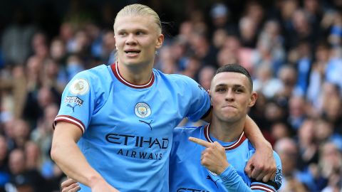 Haaland (left) and Phil Foden both scored hat-tricks against Mancheser United. 
