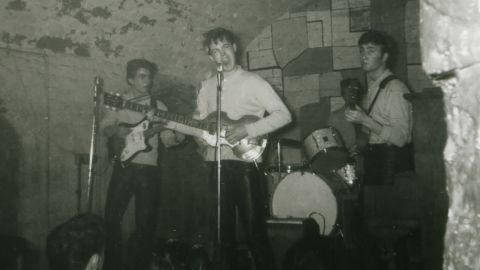A rare image showing (L-R) George Harrison, Paul McCartney and John Lennon. Drummer Pete Best is partially visible.