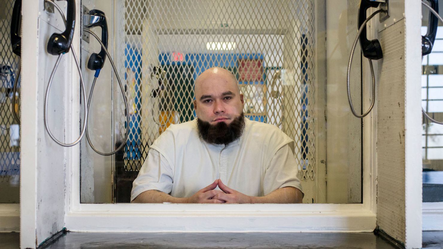 Texas death row inmate John Henry Ramirez is seen in 2021 in the visitation area of the Allan B. Polunsky Unit in Livingston, Texas.