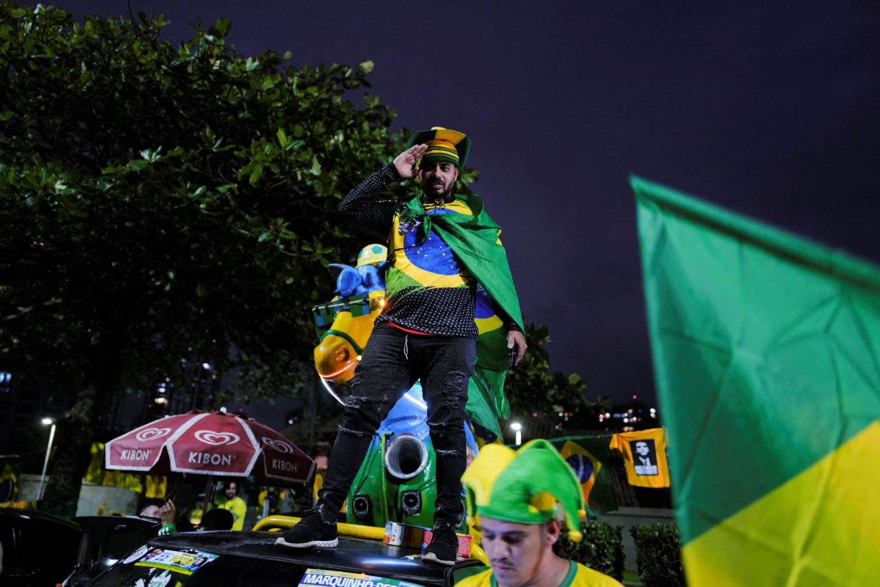 Supporters gather outside Bolsonaro's home in Rio de Janeiro on October 2.<br />.