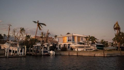 Boats rest on a canal property on Sanibel Island after Hurricane Ian.