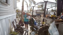 Les Pickett, 84, attempts to gather a few items from his home before he leaves for the Estero Park and Recreation Center to shelter for the night on Wednesday, October 5, 2022. The Picketts were home when Hurricane Ian hit. Water rose to their chins and their furniture began to float around them. 