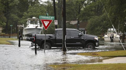 Despite being covered by water, some drivers braved the roads in Virginia Beach, Virginia, Monday.