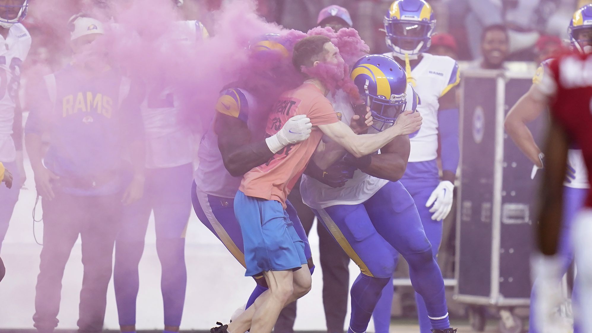 A protester meets the full force of Los Angeles Rams defensive end Takkarist McKinley, left, and linebacker Bobby Wagner during the Monday night game against the San Francisco 49ers on October 3. "He looked like he wasn't supposed to be on the field," Wagner told reporters after the game. "I saw security was having a little problem -- so I helped him out." The 49ers went on to dominate the Rams behind a stout defense that had seven sacks and an interception, winning 24-9 to move to 2-2 on the season.