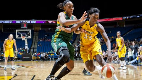 A Tulsa Shock-era Jackson (R) heads for the basket during the Seattle Storm's game against LeCow Willingham on June 21, 2011 at the BOK Center in Oklahoma.