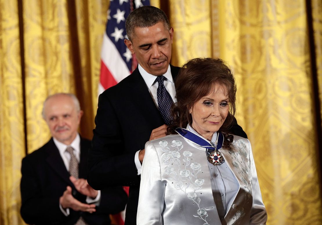 Then President Barack Obama awards the Presidential Medal of Freedom to Loretta Lynn in 2013.