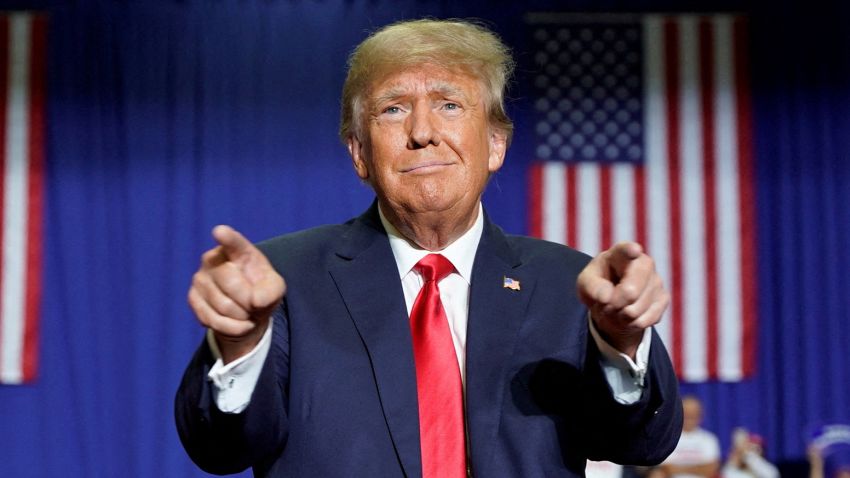 Former U.S. President Donald Trump gestures during a rally in Warren, Michigan, U.S., October 1, 2022.