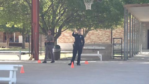 Elizondo, on the right in her new UCISD uniform, declined to talk to CNN.