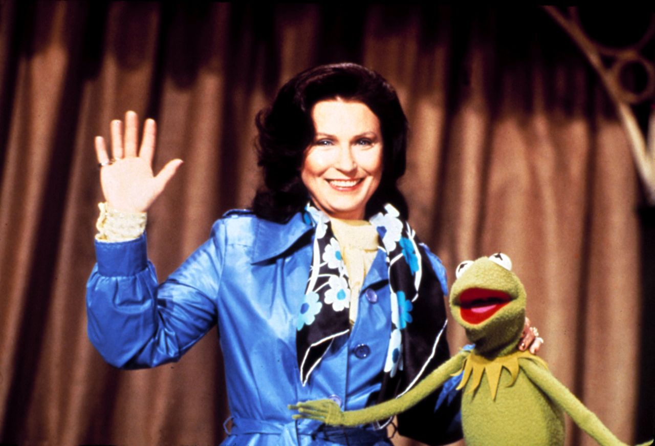 Lynn stands with Kermit the Frog on the Muppet Show in 1978. 