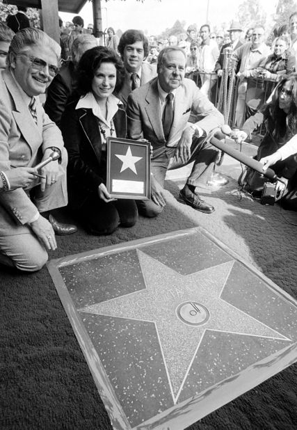 Lynn holds up a commemorative plaque at the dedication of a star honoring her at the Hollywood Walk of Fame in Los Angeles in 1978.
