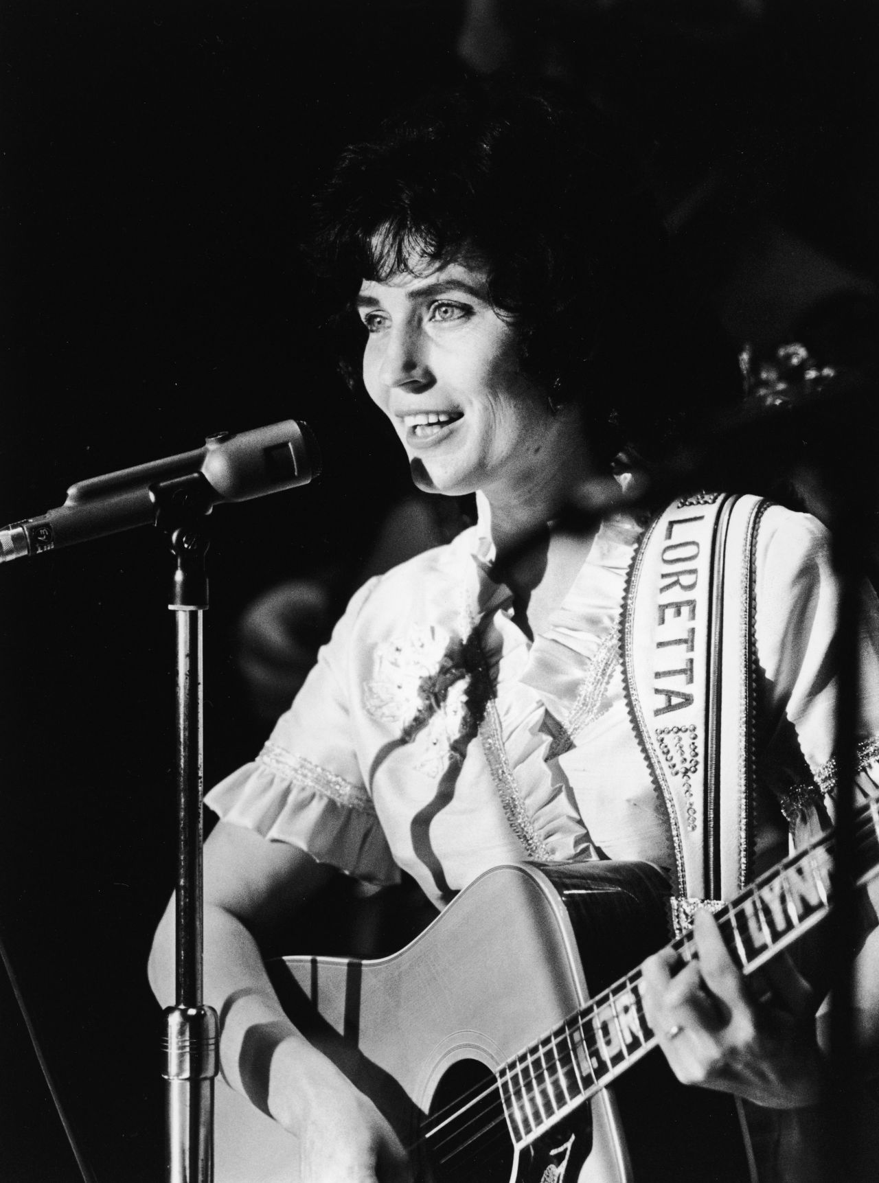 Lynn performs on stage at the Grand Ole Opry in the '60s.