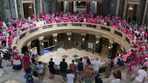 Dozens of protesters gather in the Wisconsin state Capitol rotunda in Madison on June 22, 2022, in hopes of convincing Republican lawmakers to repeal the state's 173-year-old ban on abortions. 