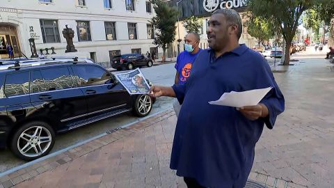 Jimmy Hill handing out flyers in downtown Atlanta.