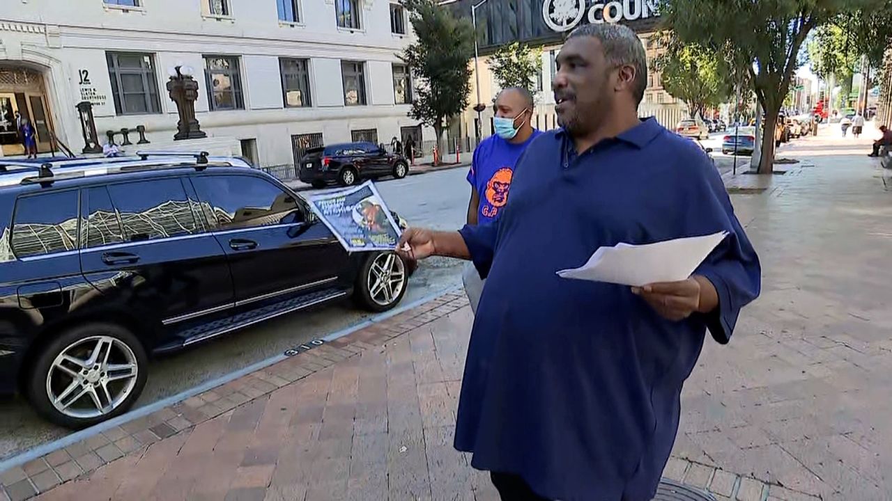 Jimmy Hill hands out fliers in downtown Atlanta.