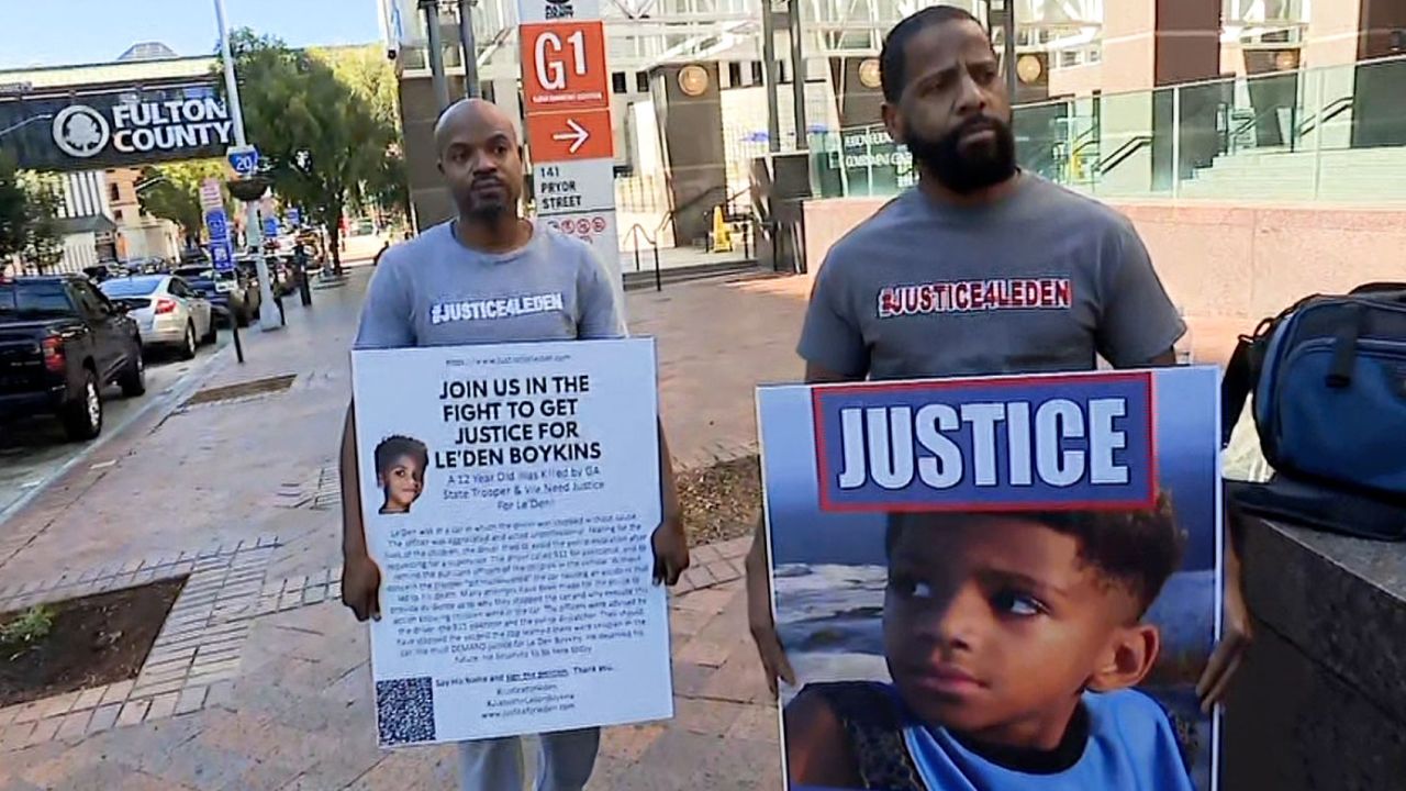 Anthony Boykins', right, 12-year-old was killed in a crash when a Georgia State Trooper executed a pit maneuver on the car in which his son was a passenger.