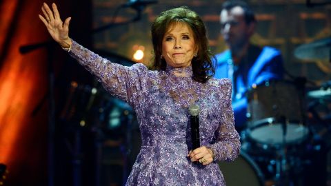 Loretta Lynn waves to the crowd after performing during the Americana Music Honors and Awards show on Wednesday, Sept. 17, 2014, in Nashville, Tennessee. Lynn died on Tuesday at the age of 90.