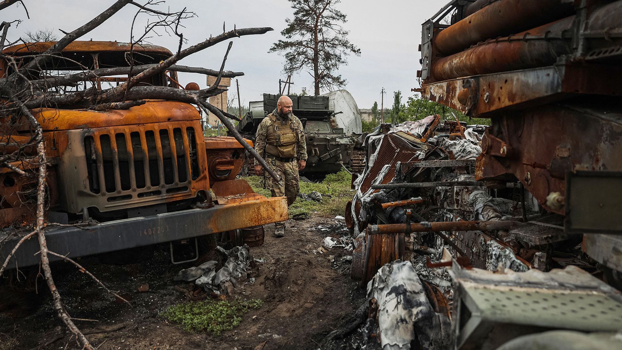 A Ukrainian serviceman examines a destroyed Russian Uragan MLRS near the village of Sosnove, in the Donetsk region, on Friday.