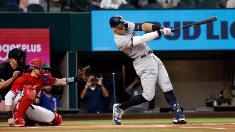 ARLINGTON, TX - OCTOBER 4: Aaron Judge #99 of the New York Yankees hits his 62nd home run of the season against the Texas Rangers during the first inning in game two of a double header at Globe Life Field on October 4, 2022 in Arlington, Texas. Judge has now set the American League record for home runs in a single season. (Photo by Ron Jenkins/Getty Images)