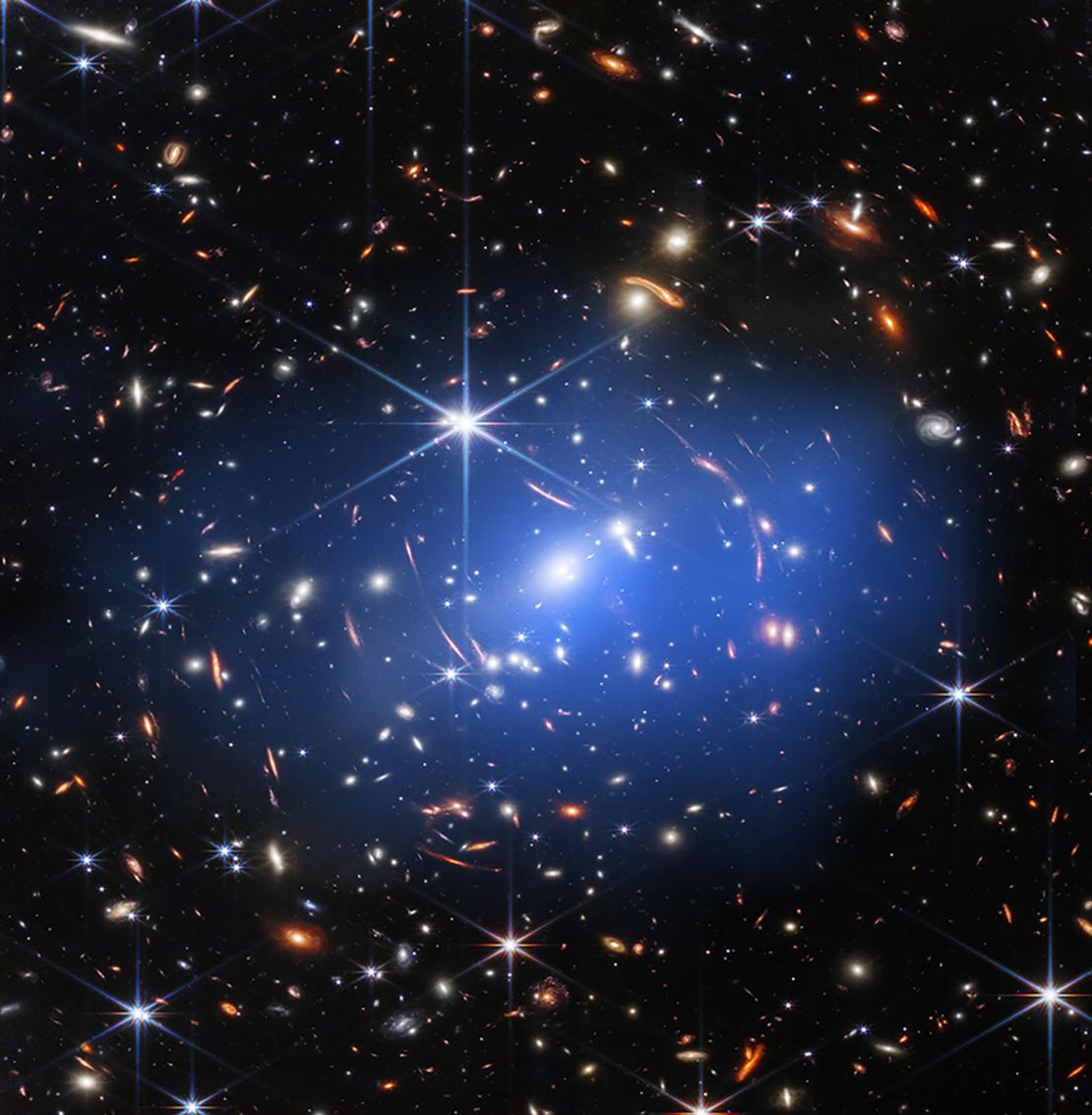 Webb's deep view of distant galaxies now sports the blue haze of X-rays from Chandra's data.