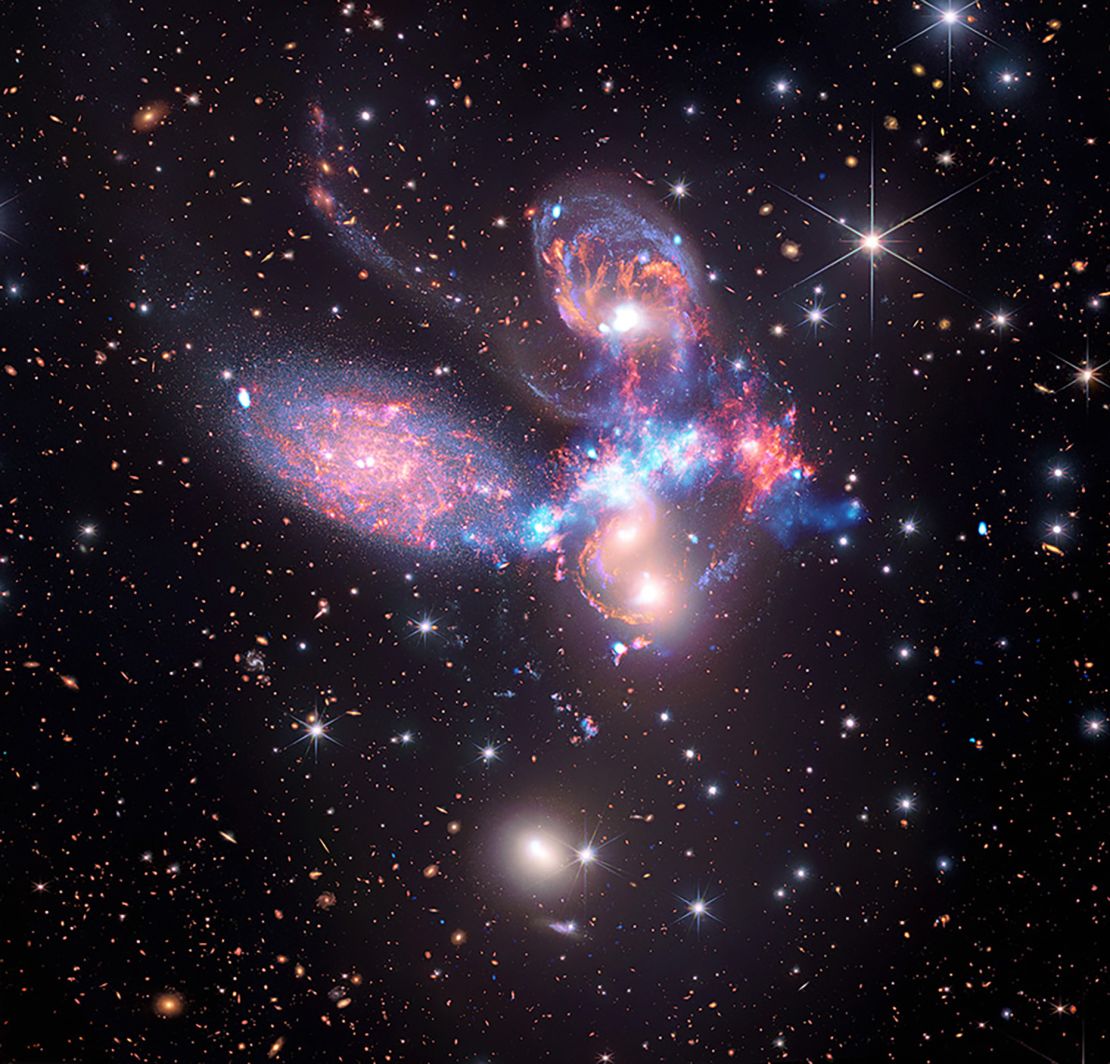 Stephan's Quintet contains a shock wave, shown in light blue, that was revealed by Chandra.
