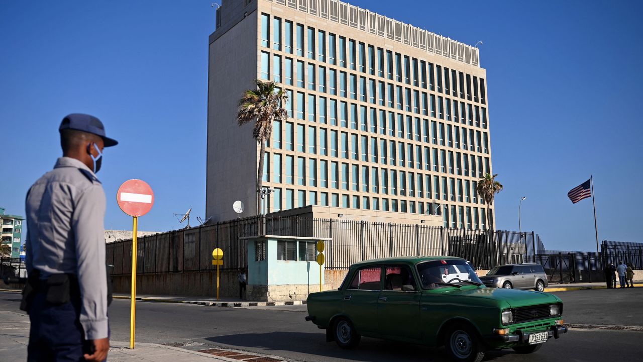 A police officers stands guard across the street from the US embassy in Havana, Cuba on May 3, 2022.