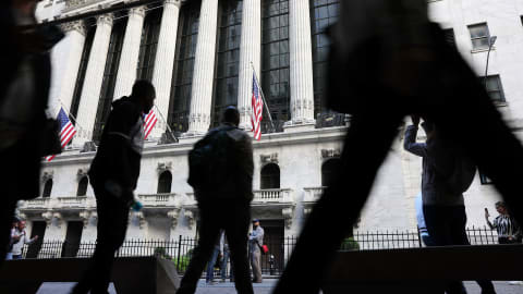 NEW YORK, NEW YORK - SEPTEMBER 23: People walk outside of the New York Stock Exchange (NYSE) on September 23, 2022 in New York City. The Dow Jones Industrial Average has dropped more than 400 points as recession fears grow. (Photo by Spencer Platt/Getty Images)