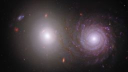 Researchers traced light that was emitted by the bright white elliptical galaxy on the left through the spiral galaxy at right. As a result, they were able to identify the effects of interstellar dust in the spiral galaxy. Webb's near-infrared data also shows us the galaxy's longer, extremely dusty spiral arms in far more detail, giving them an appearance of overlapping with the central bulge of the bright white elliptical galaxy on the left, though the pair are not interacting. In this image, green, yellow, and red were assigned to Webb's near-infrared data taken in 0.9, 1.5, and 3.56 microns (F090W, F150W, and F356W respectively). Blue was assigned to two Hubble filters, ultraviolet data taken in 0.34 microns (F336W) and visible light in 0.61 microns (F606W). Read the full description and download the image files. Credit: NASA, ESA, CSA, Rogier Windhorst (ASU), William Keel (University of Alabama), Stuart Wyithe (University of Melbourne), JWST PEARLS Team