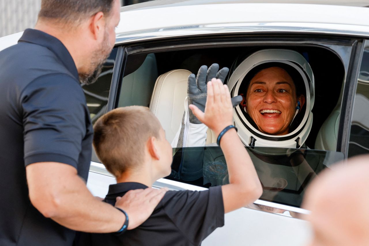 Astronaut Nicole Mann greets her family while departing the crew quarters. She is now the first Native American woman ever to travel to space. She's also serving as mission commander, making her the first woman ever to take on such a role for a SpaceX mission.