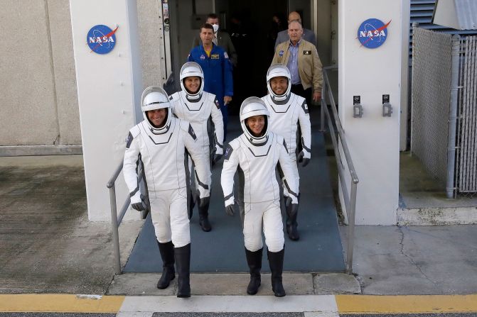 The four crew members leave the Operations and Checkout building before heading to the launch pad on Wednesday. Joining Kikina and Mann are Josh Cassada of NASA, front left, and Koichi Wakata of JAXA, or the Japan Aerospace Exploration Agency.