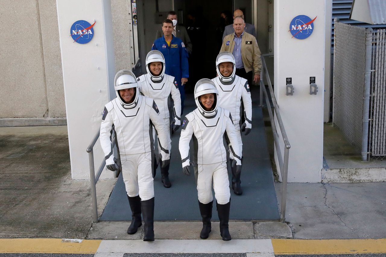 The four crew members leave the Operations and Checkout building before heading to the launch pad on Wednesday. Joining Kikina and Mann are Josh Cassada of NASA, front left, and Koichi Wakata of JAXA, or the Japan Aerospace Exploration Agency.