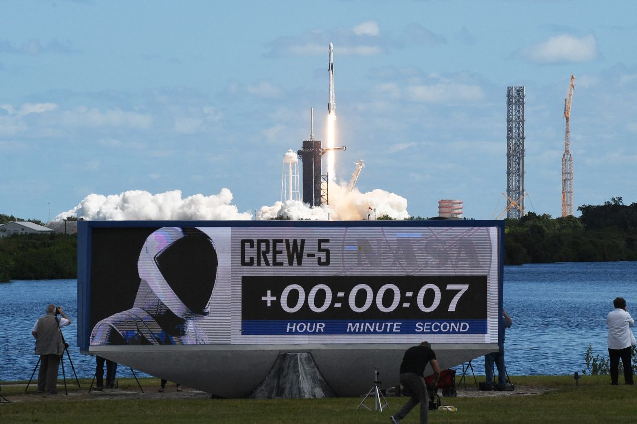 A countdown clock is shown as the rocket lifts off.