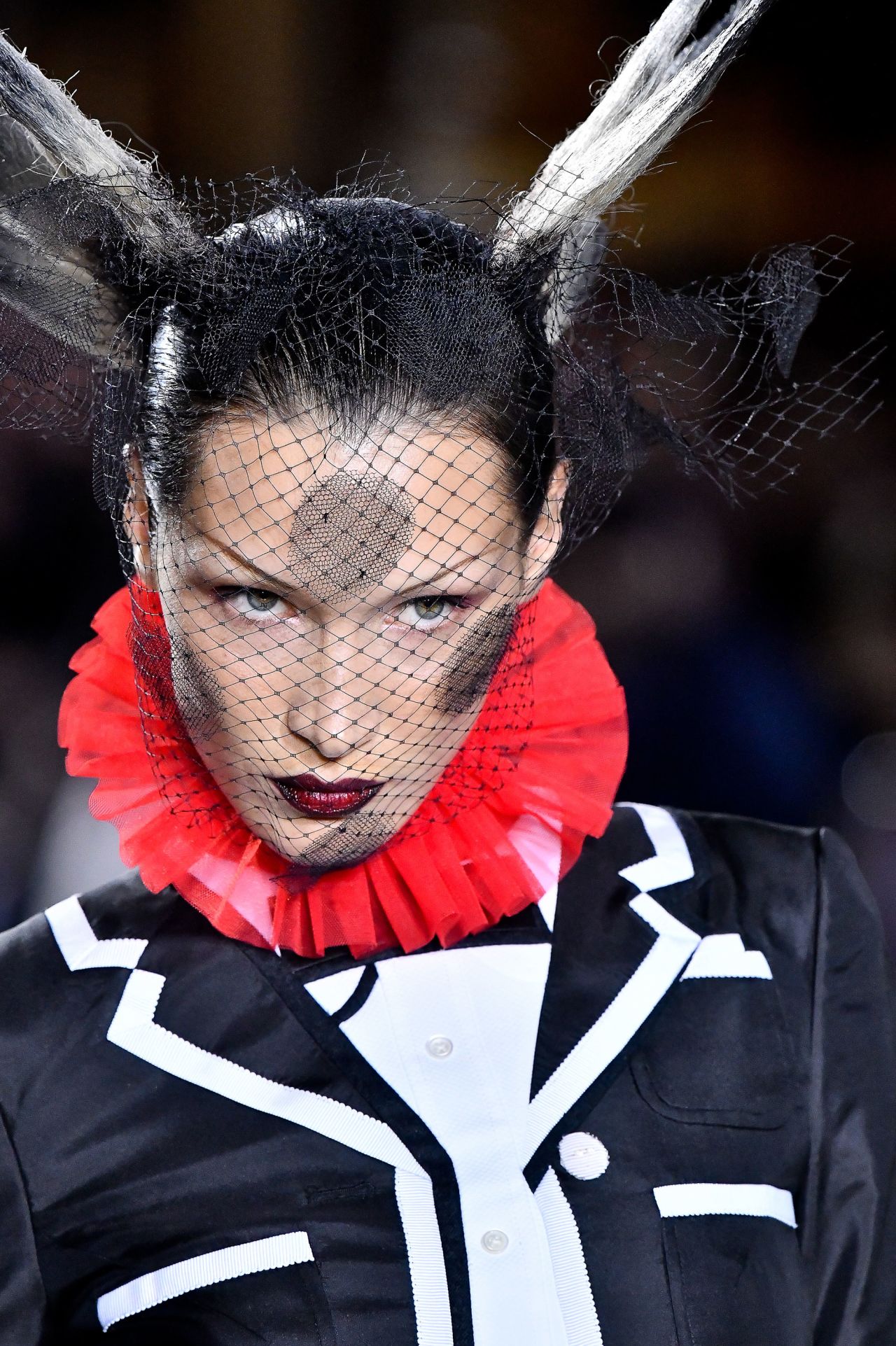 Tulle collars popped up from long opera coats complete with preppy, varsity-style piping.