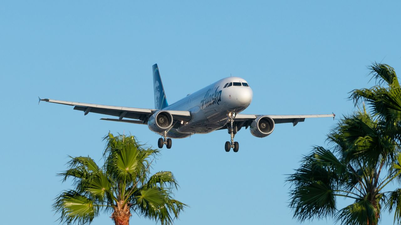 An Alaska Airlines flight arrives at Los Angeles International Airport on October 2. How you time your ticket purchase can depend on a lot of personal factors in addition to airline prices.