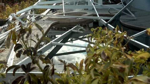 Julie Emig and Vicki Paskaly's pool was covered with metal and wood debris when they returned for the first time a week after Hurricane Ian hit Sanibel Island.