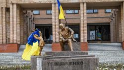 TOPSHOT - A photograph taken on September 10 , 2022, shows Ukrainian flags placed on statues in a square in Balakliya, Kharkiv region, amid the Russian invasion of Ukraine. - Ukrainian forces said on September 10, 2022 they had entered the town of Kupiansk in eastern Ukraine, dislodging Russian troops from a key logistics hub in a lightning counter-offensive that has seen swathes of territory recaptured. (Photo by Juan BARRETO / AFP) (Photo by JUAN BARRETO/AFP via Getty Images)