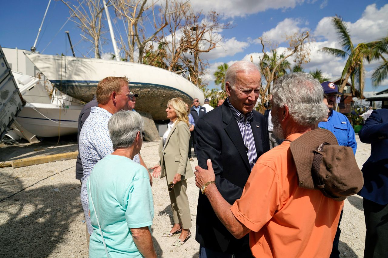 President Joe Biden and first lady Jill Biden talk to people impacted by Hurricane Ian in Fort Myers, Florida, during a tour of the area on Wednesday, October 5.
