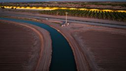 YUMA, ARIZONA - SEPTEMBER 27: In this aerial view, the All-American Canal flows near a section of the U.S.-Mexico border fence on September 27, 2022 in Yuma, Arizona. The canal, which draws water from the Colorado River, irrigates U.S. farms along the Arizona and California borderlands with Mexico. (Photo by John Moore/Getty Images)Images)