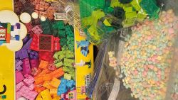 A woman was arrested allegedly carrying 15,000 pills in a Lego box in what officials say was New York City's largest-ever seizure of rainbow fentanyl.