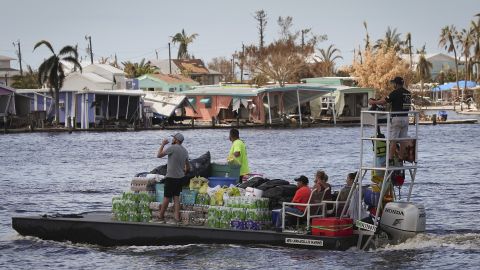 Pine Island residents bring water and other supplies to the island Wednesday in Matlacha, Florida. 